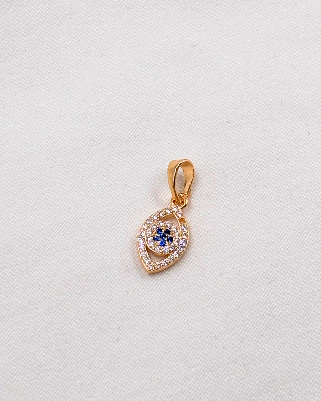 Dije Ojo Almendra Circonia Azul Marino - Oro Laminado